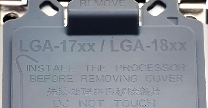 Первая фотография крышечки для защиты процессорных разъемов LGA17xx/18xx